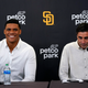 Juan Soto smiles as he sits alongside Padres president of baseball operations and “big spender” A.J. Preller.
